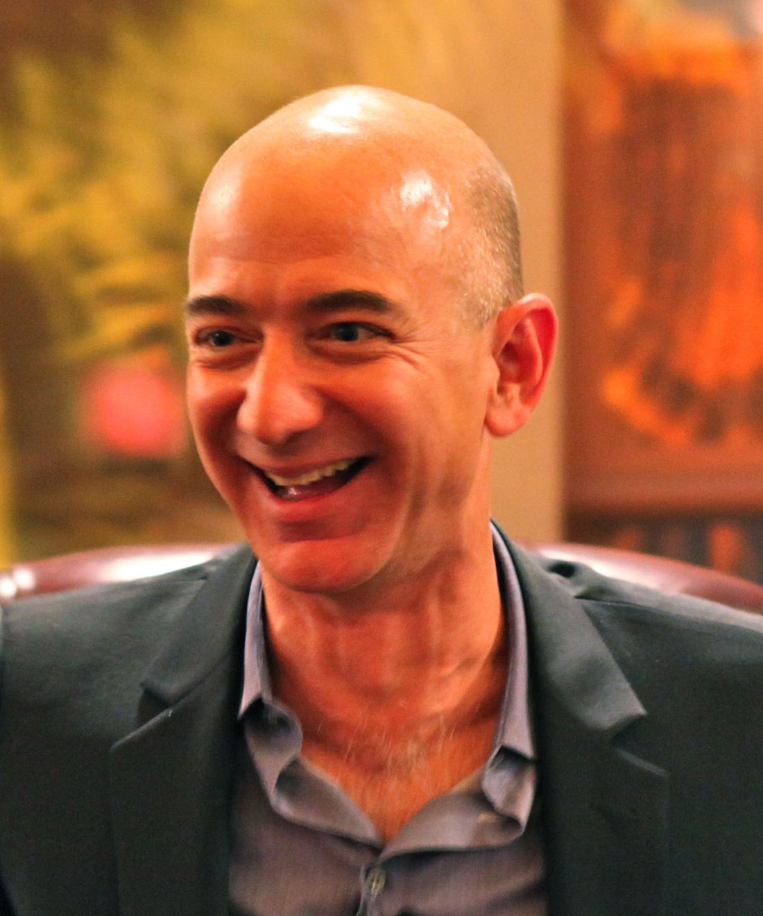 Amazon founder Jeff Bezos laughing during a conversation